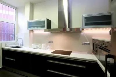 a kitchen with a sink and a counter top at Reino de Valencia Apartments in Valencia