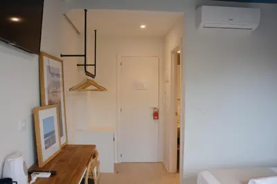 a room with a table and a hallway with a door at YOU & CO. Saler Beach Boutique in Valencia