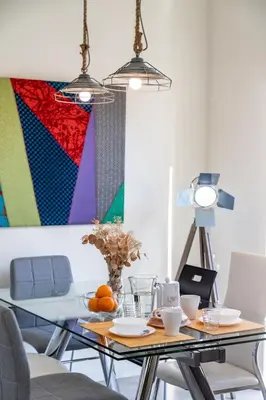 a dining room with a table with fruits on it at Travel Habitat Ruzafa Apartment in Valencia