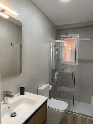 a bathroom with a toilet and a sink and a shower at Valencia Central Apartment two bedrooms for Rent from more than 10 days in Valencia