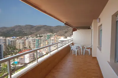 a balcony of a apartment with a table and chairs at Apartamentos Florazar II Ajhory in Cullera