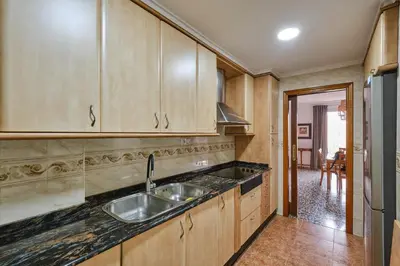 a white bathroom with a sink and a toilet at Atarazanas Flat in Valencia