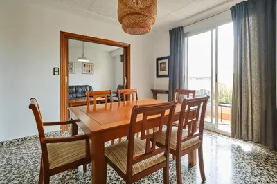 a kitchen with wooden cabinets and a sink at Atarazanas Flat in Valencia