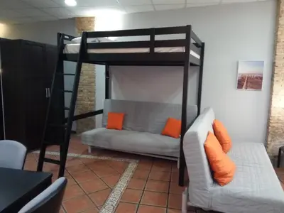 a room with a revolving door with a red car outside at Espai Loft Valencia in Valencia