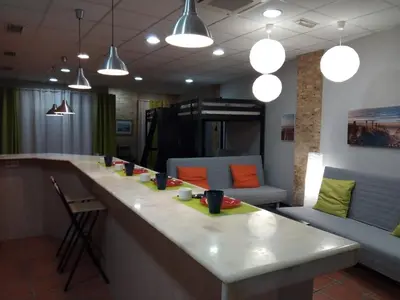 a living room with two couches and orange pillows at Espai Loft Valencia in Valencia