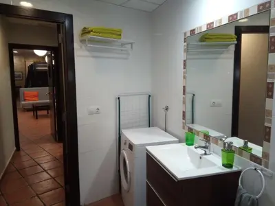 a bar in a room with chairs and a table at Espai Loft Valencia in Valencia