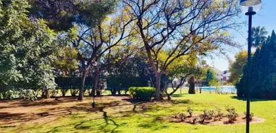 a park with trees and a light pole at APARTAMENTO CERCA DE PLAYA Y MONTAÑA IDEAL FAMILIAS O RELAX in Puzol