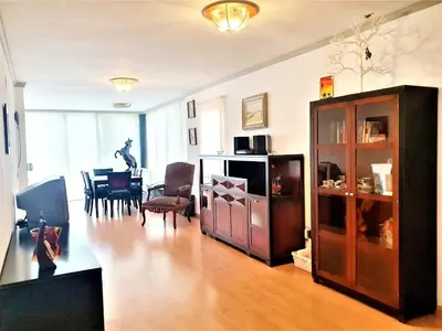 a living room with a table and a dining room at APARTAMENTO CERCA DE PLAYA Y MONTAÑA IDEAL FAMILIAS O RELAX in Puzol