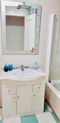 a bathroom with a sink and a mirror and a tub at APARTAMENTO CERCA DE PLAYA Y MONTAÑA IDEAL FAMILIAS O RELAX in Puzol