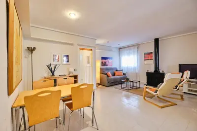 a kitchen and living room with a table and chairs at Penthouse Inlakesh in Valencia