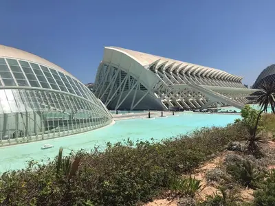 a building with a pool of water in front of it at Apartment near the BIO PARC in Valencia