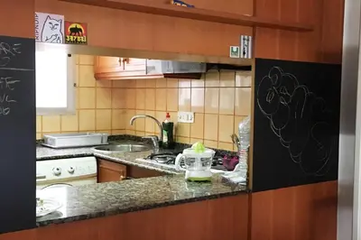 a kitchen with a sink and a counter top at Rio Turia Skatehouse in Valencia