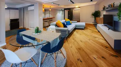 a living room with a couch and a table and chairs at Hexagonal Design Apartment in Valencia