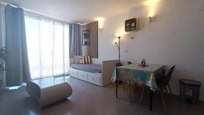 a living room with a couch and a table in it at Acogedor Apartamento in Valencia
