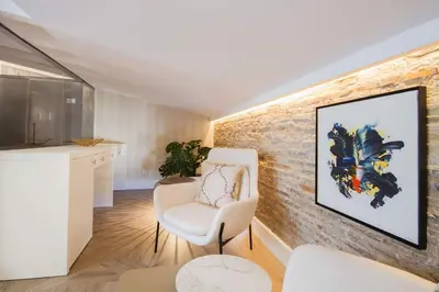 a living room with a brick wall at MYR Palacio Vallier in Valencia