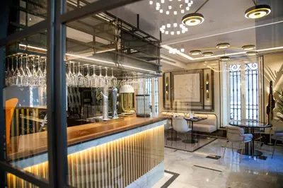 a bar in a restaurant with glasses on the wall at MYR Palacio Vallier in Valencia