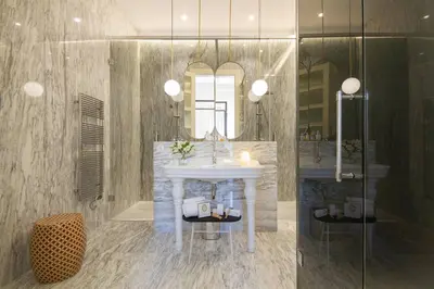 a bathroom with a white sink and a mirror at MYR Palacio Vallier in Valencia