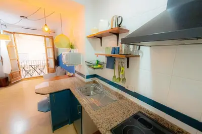 a kitchen with a sink and a counter top at Catedral Apartments in Valencia
