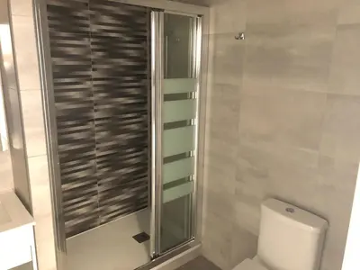 a bathroom with a toilet and a glass shower at Zerka Sendra in Valencia
