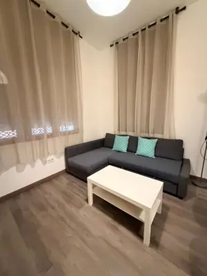 a living room with a couch and a coffee table at Zerka Sendra in Valencia