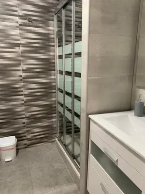 a bathroom with a shower and a toilet and a sink at Zerka Sendra in Valencia