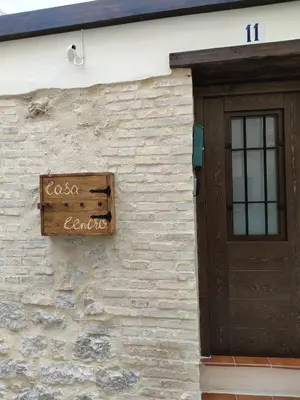 a sign on the side of a building with a door at Casa Centro Jérica in Jérica