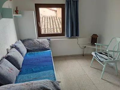 a living room with a couch and a window at Casa Centro Jérica in Jérica