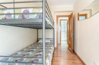 a bedroom with a bunk bed in a room at Casa los Buhos in Valencia