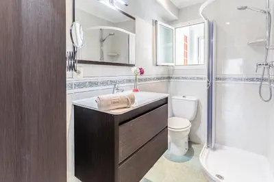a bathroom with a sink and a toilet and a shower at Casa los Buhos in Valencia