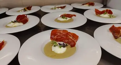 a group of white plates of food on a table at El Cerrao-PauNatura in Sot de Chera