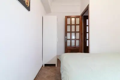 a bedroom with a bed and a mirror at La Casa de los Espejos in Valencia