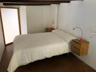 a bedroom with a white bed and a window at Cozy en Blanch. Center in Valencia