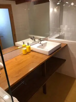a bathroom with a sink and a mirror at Cozy en Blanch. Center in Valencia