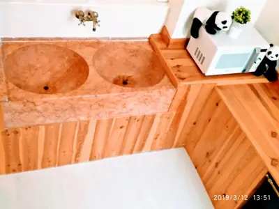 a bathroom with two wooden sinks in a room at Valencian Dreams Lonja in Valencia