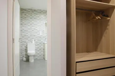 a bathroom with a toilet and a sink in a room at Partenopeo 26 in Valencia