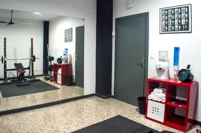 a room with a gym with a hair salon at Quart Youth Hostel & Apartments in Valencia