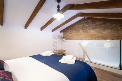 a bedroom with a bed with towels on it at ANELSA Apmts DESCUBRE VALENCIA Y SU PLAYA in Valencia
