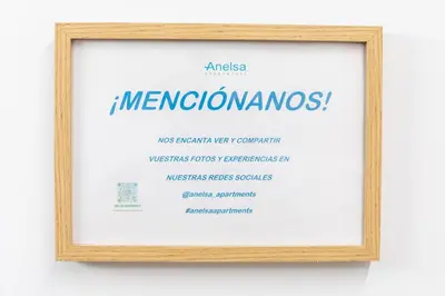 a framed picture of a mexican sign at ANELSA Apmts DESCUBRE VALENCIA Y SU PLAYA in Valencia