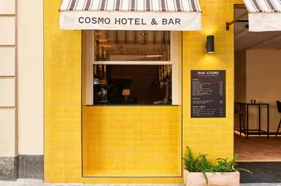 a yellow tiled storefront of a restaurant at Room Mate Cosmo - City Centre, Valencia in Valencia