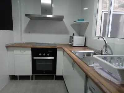 a small kitchen with a sink and a stove at Sofia's Flat in Valencia
