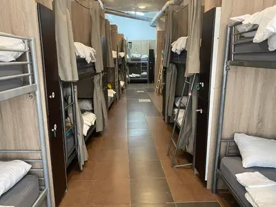 a corridor of a dorm room with bunk beds at better Oh! in Valencia