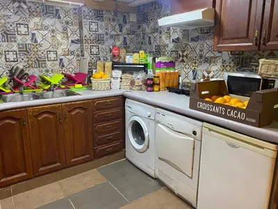 a kitchen with a dishwasher and a washing machine at better Oh! in Valencia