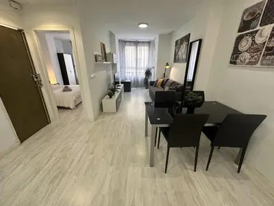 a living room with a table and chairs and a couch at Valencia Apartamento Estilo italiano in Valencia