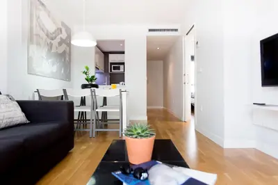 a living room with a couch and a table at Mon Suites Catedral in Valencia