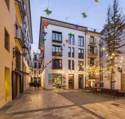 a street in a city with christmas lights at Mon Suites Catedral in Valencia