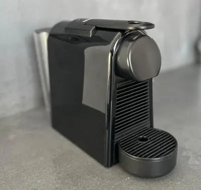 a black toaster oven sitting on top of a counter at Mon Suites Catedral in Valencia