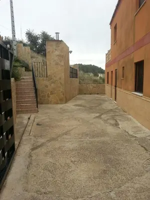 an empty parking lot in front of a building at Casa Ramos in Navarrés