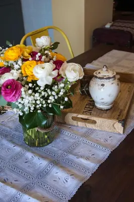 a vase of flowers sitting on a table at Sea view Port Saplaya Apartments,2 in Port Saplaya