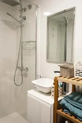 a bathroom with a sink and a shower at Sea view Port Saplaya Apartments,2 in Port Saplaya