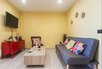 a living room with a couch and a coffee table at Sea view Port Saplaya Apartments,2 in Port Saplaya